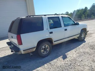 1996 Chevrolet Tahoe Limited with VIN 1GNEC13R0TJ309292, listed as a IAAI auction lot 41412643 with 219,815 mi miles. Bid and sale history available at carsss.com. Image 4.