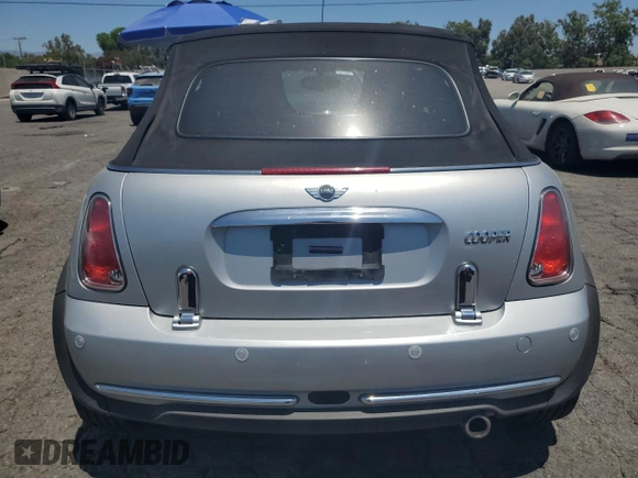 2006 MINI Convertible with VIN WMWRF33576TG16056, listed as a Copart auction lot 63127705 with 108,654 mi miles and Salvage title. Bid and sale history available at DreamBid. Image 6.