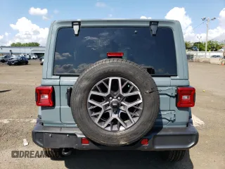 2024 Jeep Wrangler Sahara with VIN 1C4PJXEGXRW269062, listed as a Copart auction lot 64576895 with 2,159 mi miles and Salvage title. Bid and sale history available at DreamBid. Image 6.