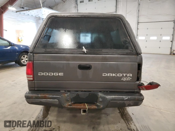 2003 Dodge Dakota z VIN 1D7GG16X23S204317, wystawiony jako Copart lot #54830745 z przebiegiem 139 508 mil mil oraz Szkoda całkowita • Salvage title. Historia ofert i sprzedaży dostępna na DreamBid. Obrazek 6.
