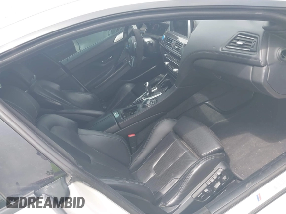 2015 BMW M6 z VIN WBS6C9C50FD467538, wystawiony jako IAAI lot #42366043 z przebiegiem 66 379 mil mil oraz . Historia ofert i sprzedaży dostępna na DreamBid. Obrazek 5.