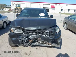 2014 Jeep Grand Cherokee Laredo with VIN 1C4RJEAG7EC263590, listed as a IAAI auction lot 41699106 with 136,581 mi miles and . Bid and sale history available at DreamBid. Image 13.