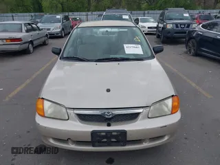 2000 Mazda Protege DX with VIN JM1BJ2227Y0237323, listed as a IAAI auction lot 42179683 with Not Provided miles and . Bid and sale history available at DreamBid. Image 6.