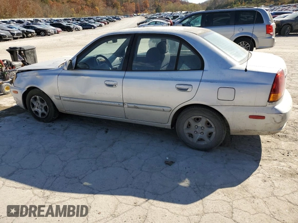 2005 Hyundai Accent GLS with VIN KMHCG45C75U638812, listed as a Copart auction lot 77968234 with 130,815 mi miles and Salvage Title. Bid and sale history available at carsss.com. Image 2.