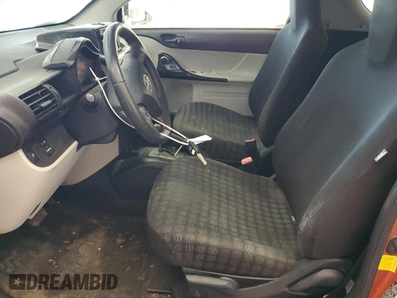 2015 Scion iQ with VIN JTNJJXB09FJ030667, listed as a Copart auction lot 87321594 with 124,895 mi miles and Salvage Title. Bid and sale history available at carsss.com. Image 7.