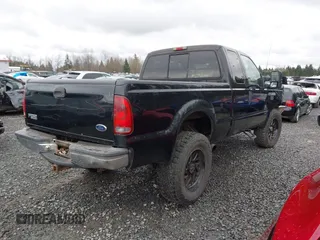 1999 Ford Super Duty F-250 XL with VIN 1FTNX21F2XEC99584, listed as a IAAI auction lot 41611098 with 424,263 mi miles. Bid and sale history available at carsss.com. Image 4.