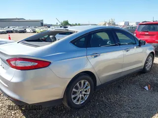 2016 Ford Fusion S z VIN 3FA6P0G76GR377005, wystawiony jako IAAI lot #42006585 z przebiegiem 100 575 mil mil oraz . Historia ofert i sprzedaży dostępna na DreamBid. Obrazek 4.