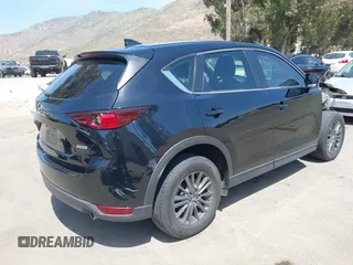 2019 Mazda CX-5 Sport with VIN JM3KFABM7K1509987, listed as a IAAI auction lot 42062804 with 50,898 mi miles and . Bid and sale history available at DreamBid. Image 4.
