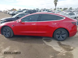 2020 Tesla Model 3 Standard Range Plus with VIN 5YJ3E1EA9LF718027, listed as a IAAI auction lot 41679320 with 68,987 mi miles. Bid and sale history available at carsss.com. Image 14.