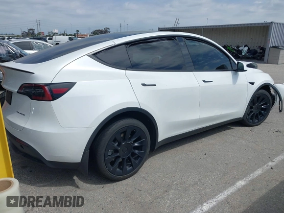 2023 Tesla Model Y Long Range with VIN 7SAYGDEE9PA026005, listed as a IAAI auction lot 41895223 with 43,813 mi miles and . Bid and sale history available at DreamBid. Image 4.