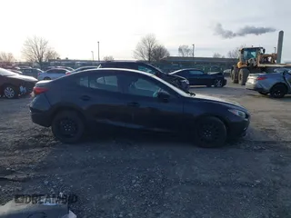 2015 Mazda 3 i SV with VIN JM1BM1T74F1246158, listed as a IAAI auction lot 41587923 with 147,001 mi miles. Bid and sale history available at carsss.com. Image 14.