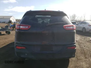 2014 Jeep Cherokee Altitude with VIN 1C4PJMCS0EW291247, listed as a Copart auction lot 47694115 with 124,775 mi miles and Salvage Title. Bid and sale history available at carsss.com. Image 6.
