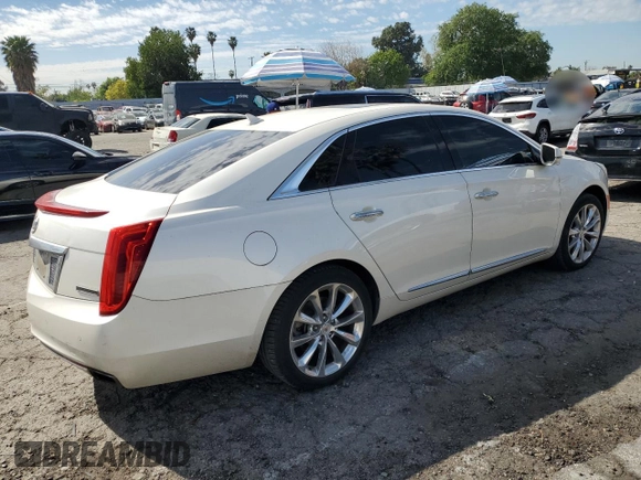 2014 Cadillac XTS Premium with VIN 2G61P5S36E9305491, listed as a Copart auction lot 44404425 with 104,710 mi miles and Salvage Title. Bid and sale history available at DreamBid. Image 3.
