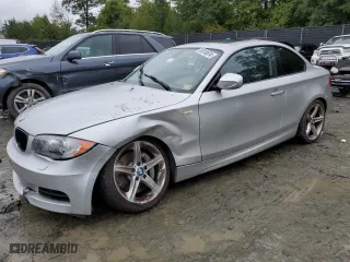 2011 BMW 1 Series 135i with VIN WBAUC9C56BVM09045, listed as a Copart auction lot 73316874 with 125,679 mi miles and Salvage Title. Bid and sale history available at carsss.com. Image 1.