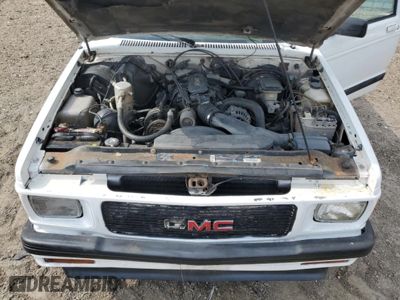 1994 GMC Jimmy Diamond Edition Luxury z VIN 1GKDT13W5R2503916, wystawiony jako Copart lot #54717215 z przebiegiem 99 991 mil mil oraz Szkoda całkowita • Salvage title. Historia ofert i sprzedaży dostępna na DreamBid. Obrazek 12.
