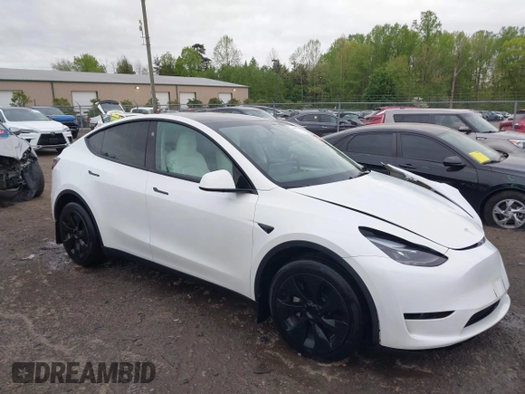 2024 Tesla Model Y Long Range with VIN 7SAYGAEE2RF014315, listed as a IAAI auction lot 42053183 with 36,521 mi miles and . Bid and sale history available at DreamBid. Image 1.