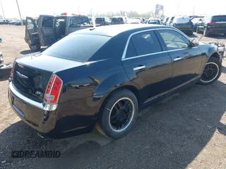 2014 Chrysler 300 C with VIN 2C3CCAKG5EH179583, listed as a IAAI auction lot 42001109 with 148,288 mi miles and . Bid and sale history available at carsss.com. Image 4.