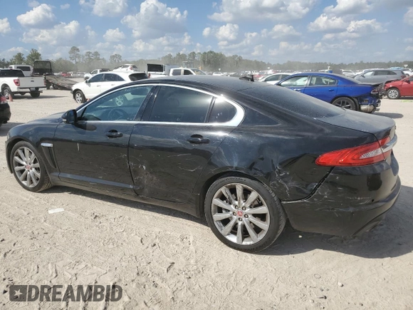 2014 Jaguar XF SC with VIN SAJWA0EX2E8U21886, listed as a Copart auction lot 76783344 with 97,280 mi miles and Salvage Title. Bid and sale history available at DreamBid. Image 2.