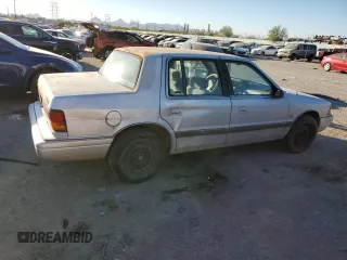 1991 Dodge Spirit z VIN 1B3XA5639MF549470, wystawiony jako Copart lot #76051284 z przebiegiem 62 309 mil mil oraz Szkody całkowita. Historia ofert i sprzedaży dostępna na DreamBid. Obrazek 3.