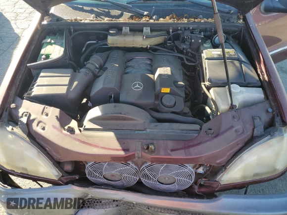 1999 Mercedes-Benz M-Class with VIN 4JGAB54E4XA101754, listed as a Copart auction lot 77903984 with 187,810 mi miles and Salvage Title. Bid and sale history available at carsss.com. Image 12.