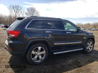 2013 Jeep Grand Cherokee Overland with VIN 1C4RJFCT2DC576125, listed as a Copart auction lot 52595165 with 100,361 mi miles and Salvage Title. Bid and sale history available at carsss.com. Image 3.