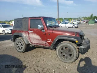 2009 Jeep Wrangler X with VIN 1J4FA24119L756089, listed as a Copart auction lot 56953205 with 158,157 mi miles and Salvage title. Bid and sale history available at DreamBid. Image 4.