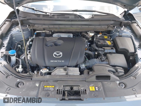 2024 Mazda CX-5 S Carbon Edition z VIN JM3KFBCLXR0521353, wystawiony jako IAAI lot #42351444 z przebiegiem 17 270 mil mil oraz . Historia ofert i sprzedaży dostępna na DreamBid. Obrazek 10.