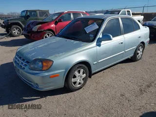 2003 Hyundai Accent GL with VIN KMHCG45C73U455357, listed as a IAAI auction lot 41395159 with 86,488 mi miles. Bid and sale history available at carsss.com. Image 2.