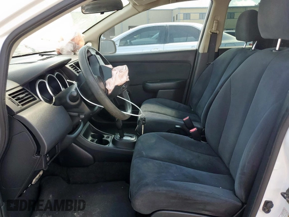 2010 Nissan Versa 1.6 with VIN 3N1CC1AP5AL403629, listed as a Copart auction lot 58264865 with 86,399 mi miles and Salvage title. Bid and sale history available at DreamBid. Image 7.