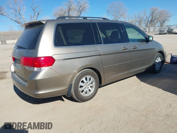 2010 Honda Odyssey EX-L with VIN 5FNRL3H79AB048049, listed as a IAAI auction lot 41440910 with 142,385 mi miles. Bid and sale history available at carsss.com. Image 4.