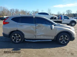 2017 Honda CR-V Touring with VIN 5J6RW2H94HL013536, listed as a IAAI auction lot 41577317 with 97,132 mi miles. Bid and sale history available at carsss.com. Image 13.