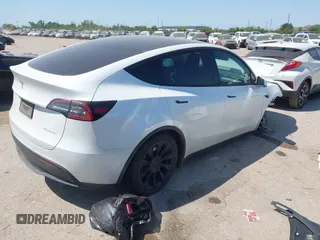 2021 Tesla Model Y Long Range with VIN 5YJYGDEE0MF265339, listed as a IAAI auction lot 41975058 with 51,292 mi miles and . Bid and sale history available at DreamBid. Image 4.