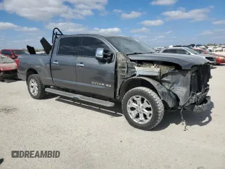 2016 Nissan Titan XD PRO-4X with VIN 1N6BA1F47GN512757, listed as a Copart auction lot 77429314 with 152,756 mi miles and Salvage Title. Bid and sale history available at carsss.com. Image 4.