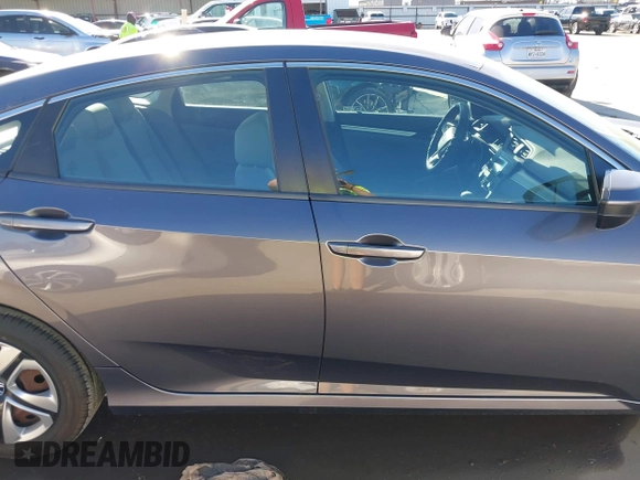 2017 Honda Civic LX z VIN 19XFC2F58HE012626, wystawiony jako IAAI lot #41458898 z przebiegiem 120 354 mil mil oraz . Historia ofert i sprzedaży dostępna na DreamBid. Obrazek 13.