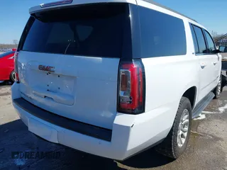 2019 GMC Yukon XL SLT with VIN 1GKS1GKC0KR330715, listed as a IAAI auction lot 41758626 with 134,641 mi miles. Bid and sale history available at carsss.com. Image 4.