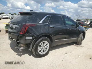 2024 Cadillac XT5 FWD Luxury with VIN 1GYKNAR42RZ731988, listed as a Copart auction lot 72777544 with 5,965 mi miles and Salvage title. Bid and sale history available at DreamBid. Image 3.