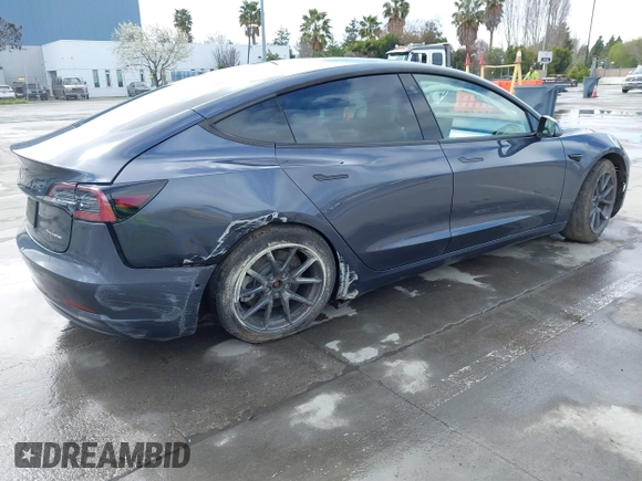 2022 Tesla Model 3 Long Range with VIN 5YJ3E1EB0NF259904, listed as a IAAI auction lot 41826642 with 42,272 mi miles and . Bid and sale history available at DreamBid. Image 4.