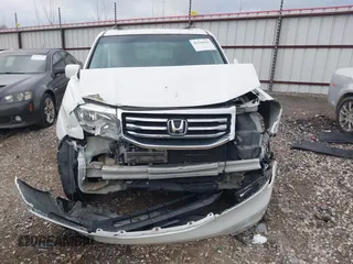 2012 Honda Pilot Touring z VIN 5FNYF4H93CB030515, wystawiony jako IAAI lot #41936563 z przebiegiem Nie podano mil oraz . Historia ofert i sprzedaży dostępna na DreamBid. Obrazek 11.