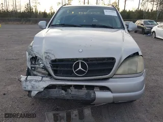1999 Mercedes-Benz M-Class with VIN 4JGAB72EXXA131890, listed as a IAAI auction lot 41721001 with 168,969 mi miles. Bid and sale history available at carsss.com. Image 6.