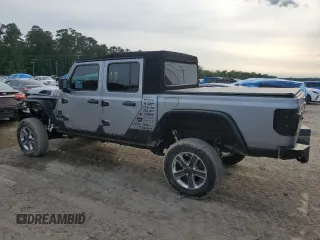 2020 Jeep Gladiator Sport S with VIN 1C6HJTAG9LL127546, listed as a Copart auction lot 54955945 with 99,511 mi miles and Salvage title. Bid and sale history available at DreamBid. Image 2.