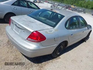 2005 Ford Taurus SE with VIN 1FAFP53U85A117320, listed as a IAAI auction lot 42121647 with 179,434 mi miles. Bid and sale history available at carsss.com. Image 4.