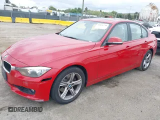 2013 BMW 3 Series 328i with VIN WBA3A5C51DF353779, listed as a IAAI auction lot 42036730 with 133,674 mi miles. Bid and sale history available at carsss.com. Image 2.