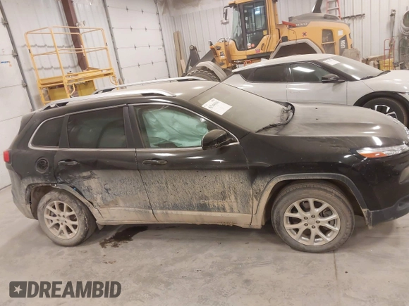 2015 Jeep Cherokee Latitude with VIN 1C4PJLCS8FW689849, listed as a IAAI auction lot 42144161 with 138,740 mi miles and . Bid and sale history available at carsss.com. Image 13.
