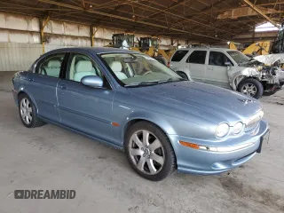 2004 Jaguar X-Type with VIN SAJEA51C14WE06627, listed as a Copart auction lot 54925735 with 107,756 mi miles and Clean Title. Bid and sale history available at DreamBid. Image 4.