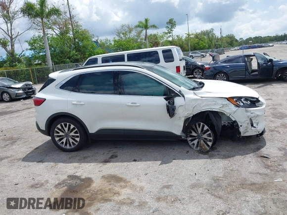 2020 Ford Escape Titanium Hybrid with VIN 1FMCU0DZ3LUC07842, listed as a IAAI auction lot 42456359 with 62,756 mi miles and . Bid and sale history available at DreamBid. Image 14.