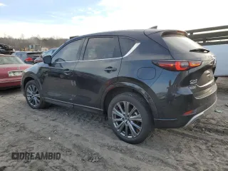 2024 Mazda CX-5 2.5 Turbo Signature with VIN JM3KFBXY7R0515256, listed as a Copart auction lot 87404694 with 4,699 mi miles and Salvage Title. Bid and sale history available at carsss.com. Image 2.
