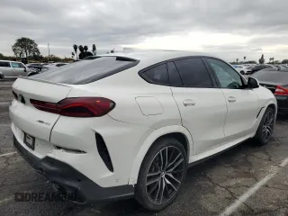 2022 BMW X6 xDrive40i z VIN 5UXCY6C08N9J21980, wystawiony jako Copart lot #48819745 z przebiegiem 24 431 mil mil oraz Szkoda całkowita • Salvage title. Historia ofert i sprzedaży dostępna na DreamBid. Obrazek 3.