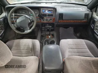1998 Jeep Grand Cherokee Laredo with VIN 1J4GZ48S3WC269693, listed as a Copart auction lot 85026074 with 308,791 mi miles and Salvage Title. Bid and sale history available at carsss.com. Image 8.