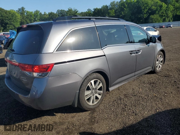 2014 Honda Odyssey Touring with VIN 5FNRL5H94EB116891, listed as a Copart auction lot 61400725 with 202,972 mi miles and Salvage title. Bid and sale history available at DreamBid. Image 3.