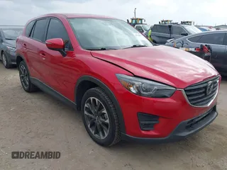 2016 Mazda CX-5 Grand Touring with VIN JM3KE2DYXG0621267, listed as a IAAI auction lot 41710973 with 151,636 mi miles. Bid and sale history available at carsss.com. Image 1.
